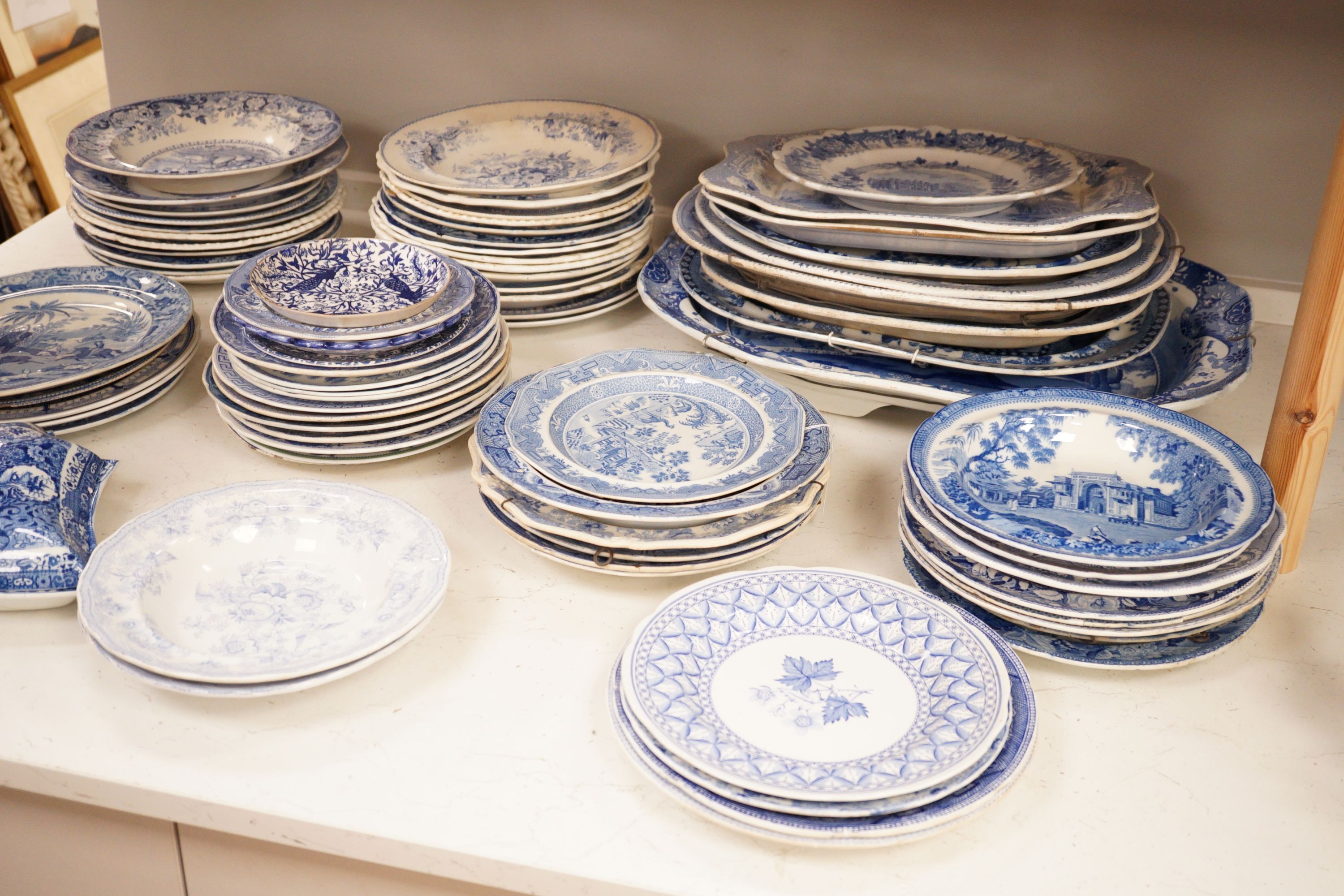 A collection of mostly 19th century blue and white transfer printed pottery tablewares